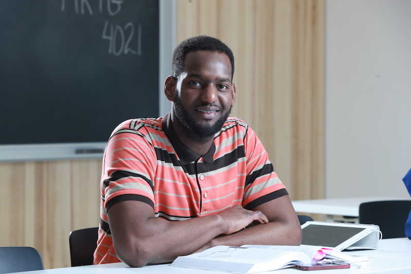 A student smiling while in class